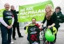 Louis Reeves and partner Gemma Russell, who are taking part in the 2013 Macmillan Dorset Bike Ride, together with fundraiser Bill Riddle, left, volunteer Peter Smith-Nicholls, and right, Chrissie Watchan-Neal, area manager of Macmillan Dorset