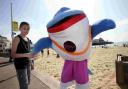 SQUEAK TO MEET YOU: Daphne the Dolphin meets Nathan Molinari on Bournemouth Beach