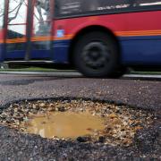 picture by Richard Crease - 17/01/14 -  RC170114bPotholes1 -   words by bmth -   large pothole in Mandale Road , Bournemouth ,  made worse by all the recent rain...COPYRIGHT BOURNEMOUTH DAILY ECHO.