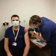 Doctor William Holdich, one of the first staff at University Hospitals Dorset to be vaccinated against Covid-19, receiving the jab from Doctor Alyson O’Donnell, UHD chief medical officer, on Wednesday, December 30