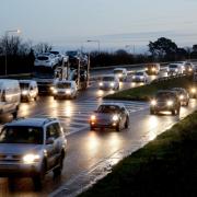 Queueing traffic on busy road following an accident