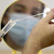 Swab collected for coronavirus test. Picture: PA