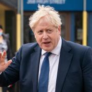 A new image has been released with Boris Johnson shown to be next to an open bottle of fizz at a Downing Street Christmas quiz (PA)