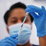 A medical professional preparing a Covid vaccine. Credit: PA