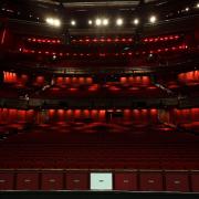 Rows of empty red theatre seats. Credit: PA