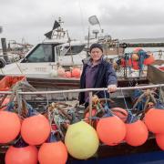 Fisherman Tom Roberts, pictured at the Fisherman's Dock in Poole Harbour, Dorset