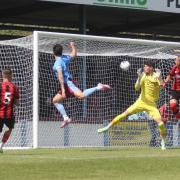 Tom Bearwish, centre left, nods home Weymouth's second goal