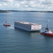 The Bibby Stockholm Barge leaving Falmouth Port this morning