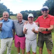 Matt Dooley, seniors captain Richard Olive, Clive Wingfield and Austin Okoye celebrating the hole in one success