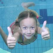 A child enjoying a swim