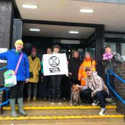 Protesters gathered outside Weymouth Magistrates' Court in solidarity with Ellie Litten (right)