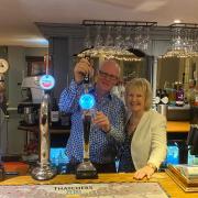 Lisa and Adam pouring their last pint