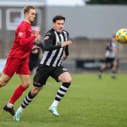 Will Fletcher, centre, has joined Wimborne Town after opting to leave Dorchester