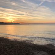 A picturesque sunrise at Bowleaze Cove