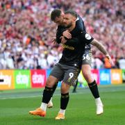 David Brooks celebrates with goalscorer Adam Armstrong