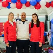 Bryony Page (left) and Izzy Songhurst (right) celebrating with coach Brian Camp