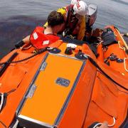 Casualty being transported from Old Harry Rocks on the inshore lifeboat