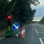 Temporary traffic lights on the A35 past Lytchett Minster