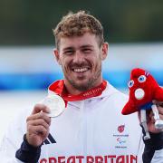 Great Britain's Jack Eyers on the podium with the silver medal after the Men's Va'a Single 200m - VL3 Final at the Vaires-sur-Marne Stadium on day eleven of the Paris 2024 Summer Paralympic Games.