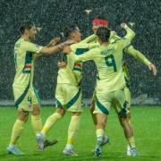 Wales’ Kieffer Moore celebrates after opening the scoring in a 2-1 Nations League victory in Montenegro (Risto Bozovic/AP)