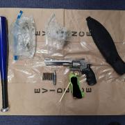 Gun discovered in a rucksack also containing drugs and a machete sheath