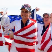 Lexi Thompson holds the Solheim Cup after helping the United States to victory against Europe (Matt York/AP)