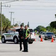 Police officers direct traffic near Trump International Golf Club after the apparent assassination attempt of Republican presidential nominee Donald Trump in West Palm Beach, Florida (Terry Renna/AP)