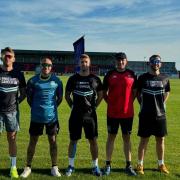 Tom Vosper (far right) with his friends as they run 10km through all 55 English cities for Prostate Cancer UK (Tom Vosper)