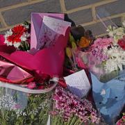 Floral tributes at Leabank in Luton (Jacob King/PA)