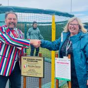 Wooden Spoon Trustee and Dorset, Wiltshire, and Hampshire Regional Chair Brett Bader with Assistant Headteacher of Portfield School Sixth Form Carol Maccoll.