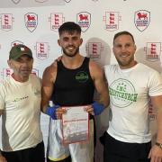 Sam Carr receiving his south eastern title certificate with John Woods and Joe Hayes