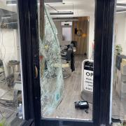 Smashed door at Boss Barber