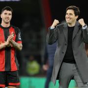 Andoni Iraola and Marcos Senesi celebrate after beating Arsenal