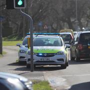 Police officers in Fairmile Road in Christchurch.