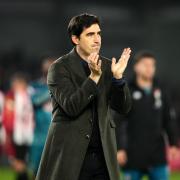 Bournemouth manager Andoni Iraola applauds the fans after the final whistle at Brentford