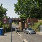 Van crashes into railway bridge and blocks road - updates