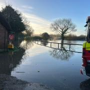 Three people were rescued in Sturminster Marshall after their vehicles became trapped in floodwater