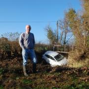 Dr Leslie Spiers helped rescue a woman from the river outisde his home after her car became trapped in floodwater