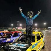 Teen takes junior banger world title in storm-hit race