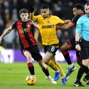 Wolverhampton Wanderers' Joao Gomes (centre) battles for the ball with Ryan Christie (left) and Tyler Adams.