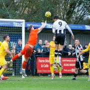 Will Fletcher beats Dorchester keeper Benfield to put Wimborne 1 up.