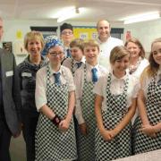 Christchurch Rotary president David Crumpler, Mary Reader, of the Christchurch Food Festival Education Trust, Ian Hewitt, Christine Emery, of Grange School, and Grange headteacher Steve Dossett with Year 10 students