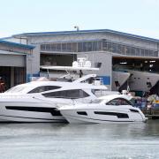 Pic - Corin Messer - 03/06/14 - cm030614pSunseeker2 .Workers with yachts at the Sunseeker boat yard on Poole Quay. .COPYRIGHT - BOURNEMOUTH DAILY ECHO.. (24767513)