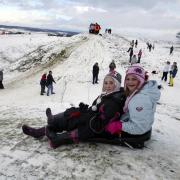 Olivia Halford and Catherine Perry enjoy tobogganing at Badbury Rings, February 2009