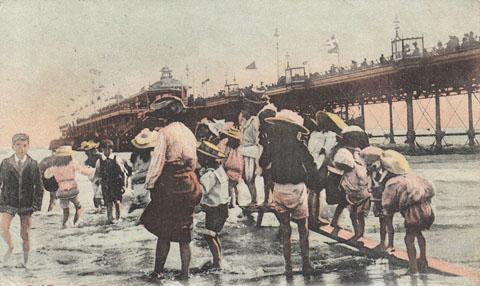 Paddling at Bournemouth. Postmarked 1904. 'Their yearly foot bath' hand written  on the back of the postcard. Submitted by John Stimson 