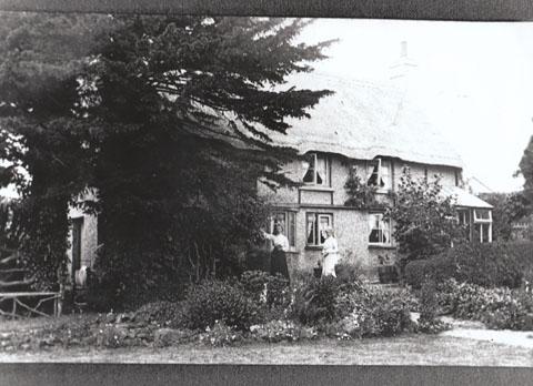 Moorside Cottage in McWilliam Road, Moordown 1917. Originally two farm workers thatched cottages, condemned in 1899 because had no drinking water. Became a Grade II listed building in 1976. Building still there. Submitted by Mrs Wendy Prendergast. 