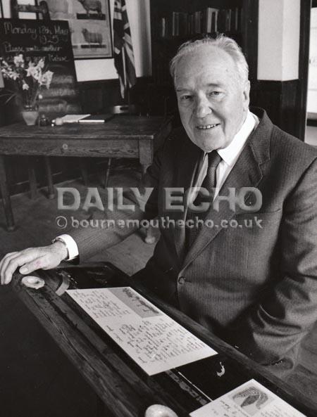 Photographer Arthur Grant back in his seat in the schoolroom at Tyneham. Taken in 1994