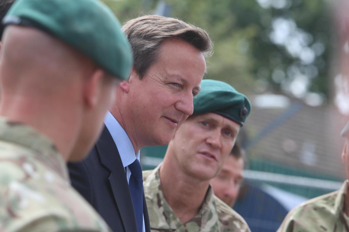 Prime Minister David Cameron and Chancellor George Osborne visit the Royal Marines base in Poole on Friday August 1, 2014