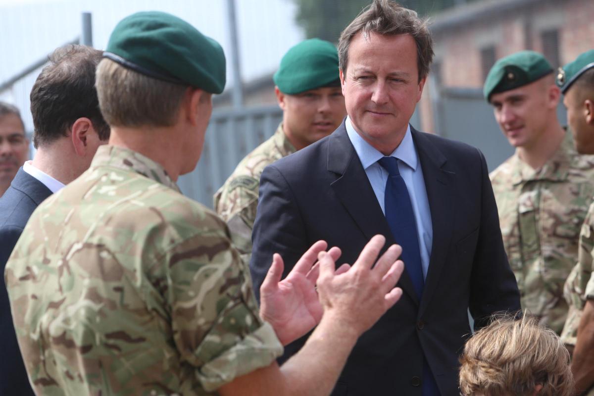 Prime Minister David Cameron and Chancellor George Osborne visit the Royal Marines base in Poole on Friday August 1, 2014