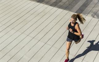 Photo via Pixabay shows a woman running.